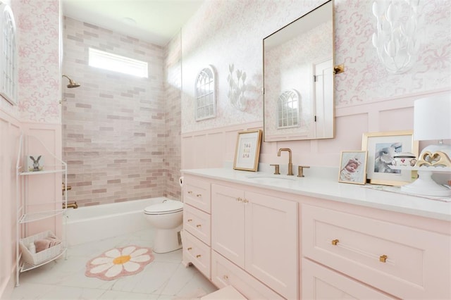 501 Old Creek Rd, Edmond, OK 73034 - bathroom with vanity, a wainscoted wall, bathing tub / shower combination, wallpapered walls, and a decorative wall