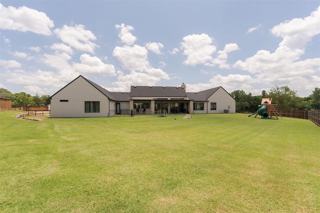 501 Old Creek Rd, Edmond, OK 73034 - rear view of property with a playground