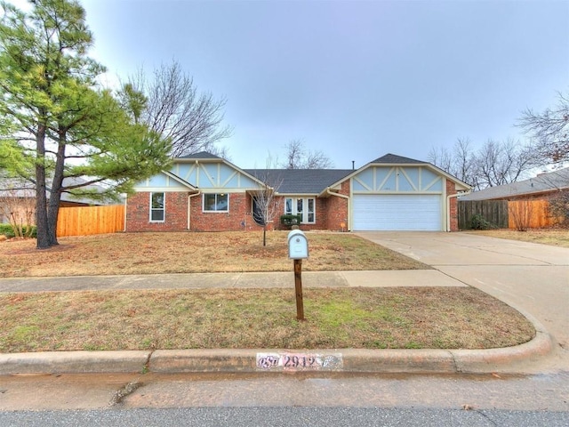 2912 Smiling Hill Blvd, Edmond, OK 73013 - view of front of home featuring an attached garage, driveway, and brick siding