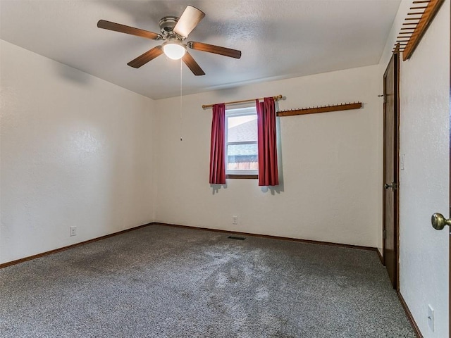 2912 Smiling Hill Blvd, Edmond, OK 73013 - spare room with a ceiling fan and carpet flooring