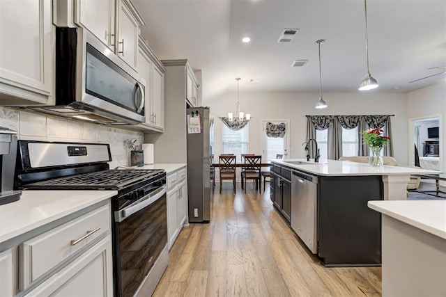 2161 Native Dancer Dr, Choctaw, OK 73020 - kitchen featuring stainless steel appliances, healthy amount of natural light, tasteful backsplash, light countertops, and recessed lighting