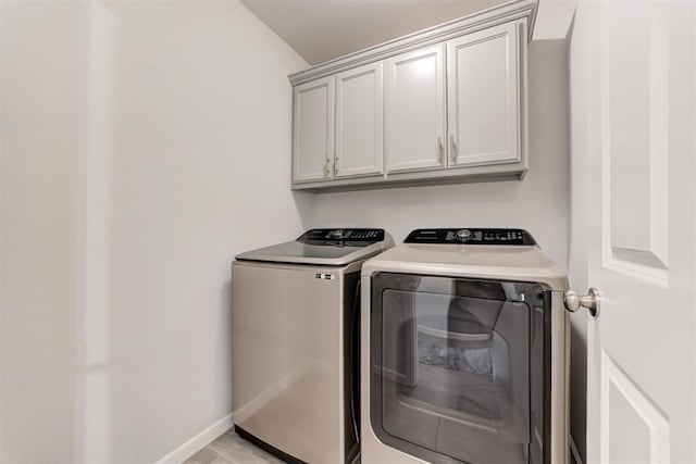 2161 Native Dancer Dr, Choctaw, OK 73020 - laundry area featuring separate washer and dryer and cabinet space