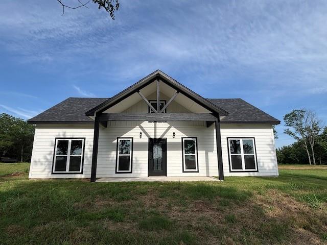 379100 E 1100th Rd, Okemah, OK 74859 - back of house featuring a lawn