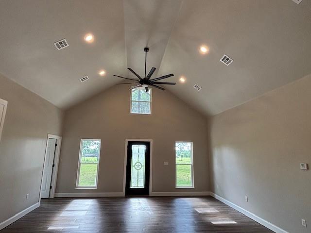 379100 E 1100th Rd, Okemah, OK 74859 - unfurnished living room featuring a ceiling fan, dark wood finished floors, high vaulted ceiling, and recessed lighting