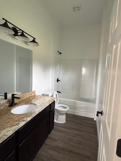 379100 E 1100th Rd, Okemah, OK 74859 - bathroom with wood finished floors, vanity, and shower / bath combination