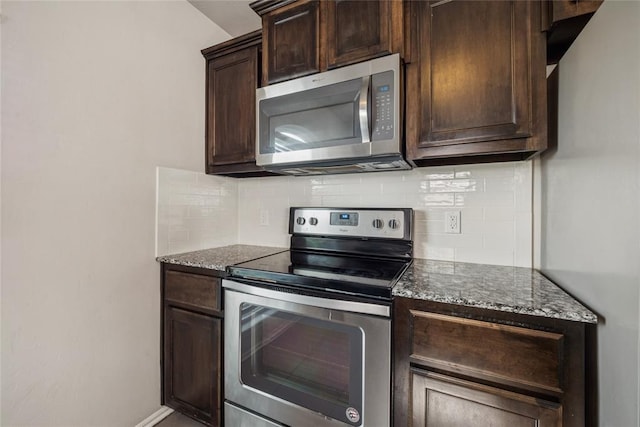 4116 NW 154th St, Edmond, OK 73013 - kitchen featuring appliances with stainless steel finishes, tasteful backsplash, dark brown cabinets, and dark stone counters