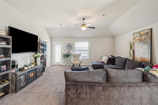 4116 NW 154th St, Edmond, OK 73013 - living room with carpet floors, vaulted ceiling, ceiling fan, and a fireplace