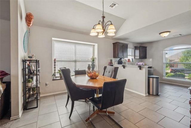 4116 NW 154th St, Edmond, OK 73013 - dining area featuring healthy amount of natural light, a chandelier, lofted ceiling, and light tile patterned floors