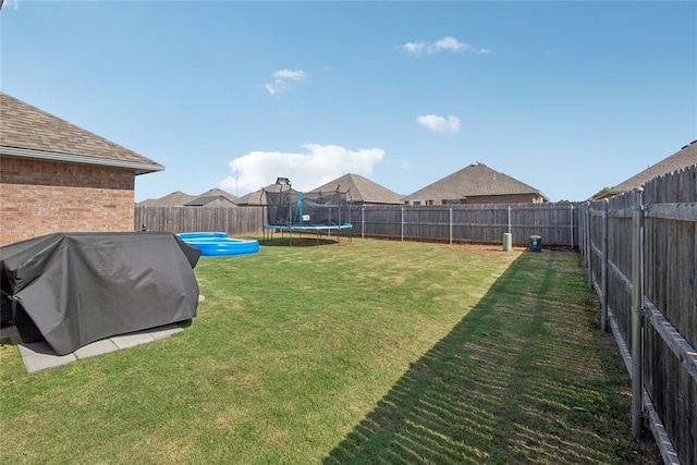 4116 NW 154th St, Edmond, OK 73013 - fenced backyard with a trampoline