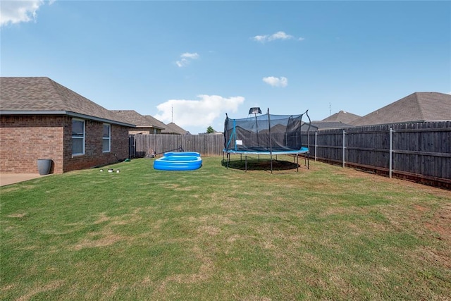 4116 NW 154th St, Edmond, OK 73013 - fenced backyard featuring a trampoline