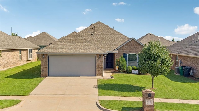 4116 NW 154th St, Edmond, OK 73013 - view of front of home featuring brick siding, an attached garage, concrete driveway, and a front yard