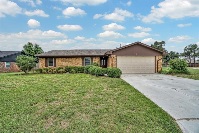 908 S Trail Dr, Altus, OK 73521 - ranch-style home featuring brick siding, a garage, concrete driveway, and a front lawn