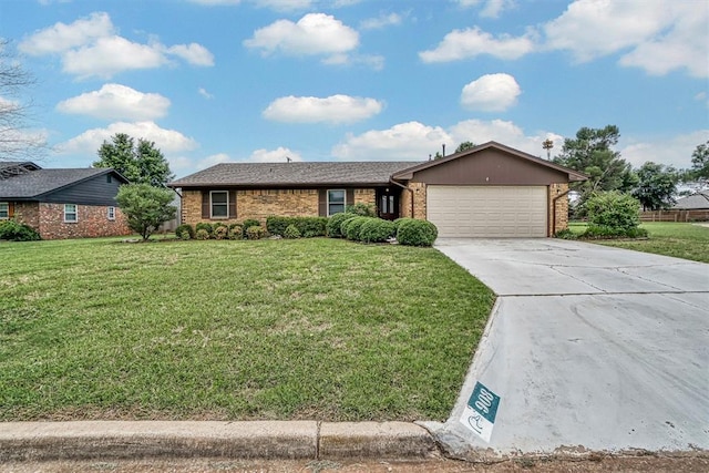908 S Trail Dr, Altus, OK 73521 - ranch-style home with brick siding, an attached garage, a front lawn, and concrete driveway