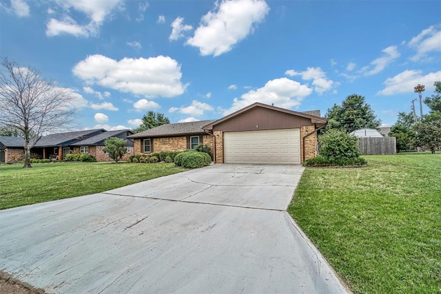 908 S Trail Dr, Altus, OK 73521 - ranch-style home featuring brick siding, a garage, and concrete driveway