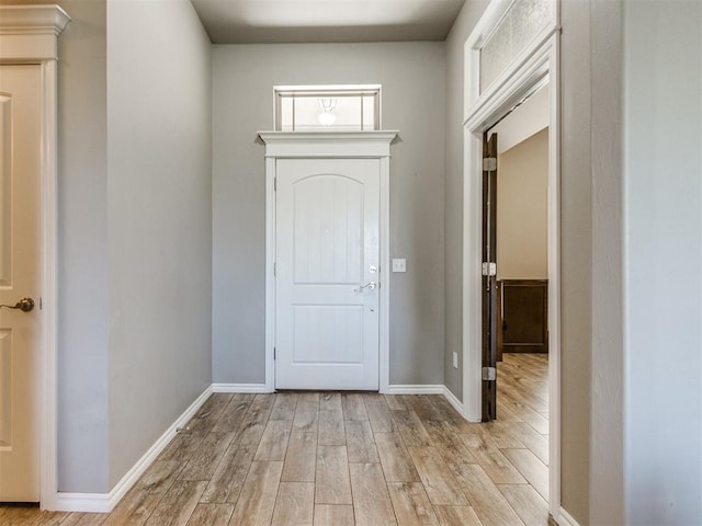 7313 Jack Dr, Oklahoma City, OK 73132 - foyer entrance featuring light wood-style floors and baseboards