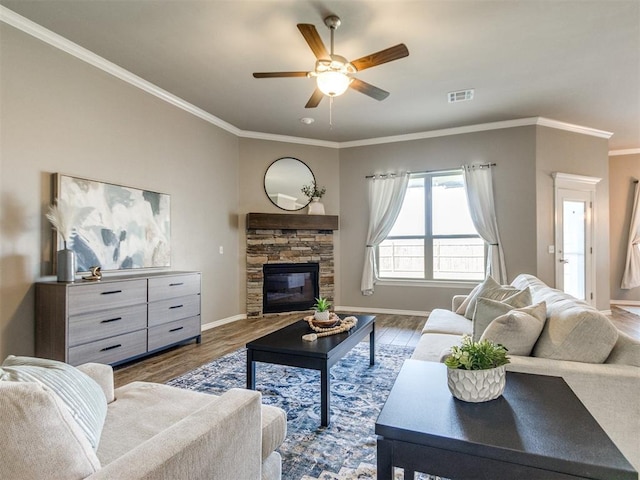 7313 Jack Dr, Oklahoma City, OK 73132 - living area with ceiling fan, wood finished floors, a fireplace, and ornamental molding