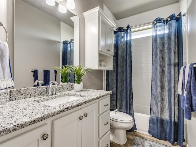 7313 Jack Dr, Oklahoma City, OK 73132 - full bathroom with vanity, wood finished floors, and shower / tub combo with curtain