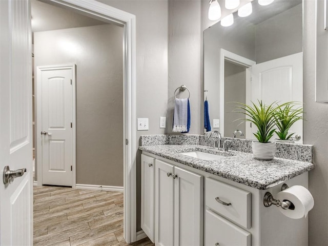 7313 Jack Dr, Oklahoma City, OK 73132 - bathroom with vanity and wood finished floors