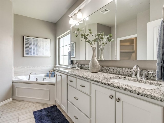 7313 Jack Dr, Oklahoma City, OK 73132 - full bath featuring double vanity and a bath
