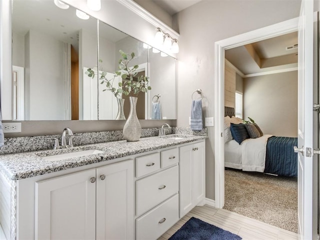 7313 Jack Dr, Oklahoma City, OK 73132 - ensuite bathroom with double vanity and baseboards