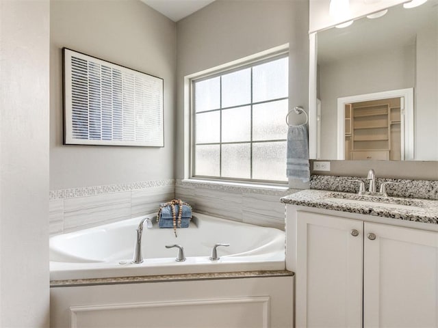 7313 Jack Dr, Oklahoma City, OK 73132 - full bath featuring vanity and a garden tub