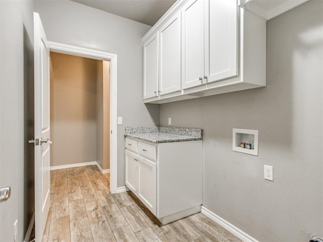 7313 Jack Dr, Oklahoma City, OK 73132 - laundry area with cabinet space, light wood finished floors, and hookup for a washing machine