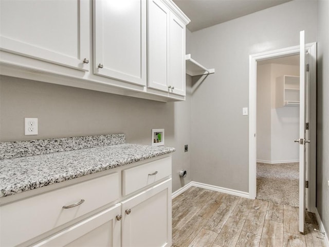 7313 Jack Dr, Oklahoma City, OK 73132 - laundry room featuring washer hookup, cabinet space, hookup for an electric dryer, and light wood finished floors