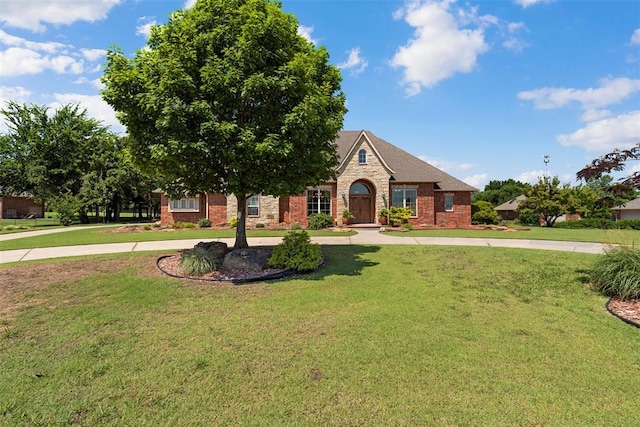 227 Quail Hollow Way, Choctaw, OK 73020 - view of front of property featuring a front yard, brick siding, and stone siding