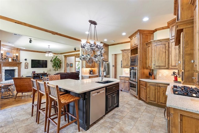 227 Quail Hollow Way, Choctaw, OK 73020 - kitchen featuring stainless steel appliances, crown molding, backsplash, a kitchen island with sink, and open floor plan