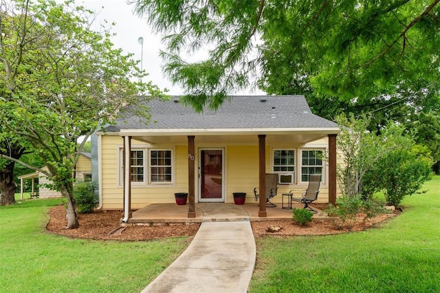 80 E Shore Dr, Arcadia, OK 73007 - view of front of house featuring a porch, a front lawn, and roof with shingles