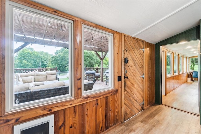 80 E Shore Dr, Arcadia, OK 73007 - doorway to outside with wooden walls and wood finished floors