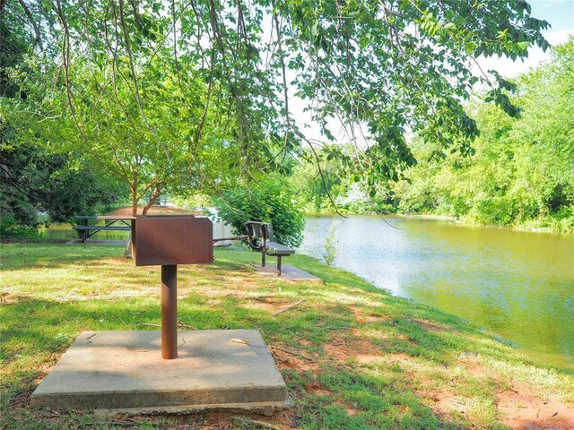 1209 Fox Bluff Ct, Edmond, OK 73034 - view of community featuring a water view, a lawn, and a view of trees
