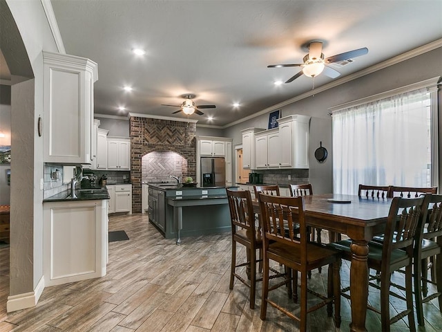 2395 County Road 1260, Blanchard, OK 73010 - dining room featuring a ceiling fan, ornamental molding, light wood-style floors, and recessed lighting
