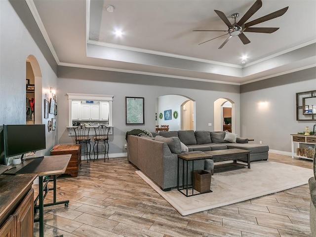 2395 County Road 1260, Blanchard, OK 73010 - living area featuring a raised ceiling, ceiling fan, light wood finished floors, and ornamental molding