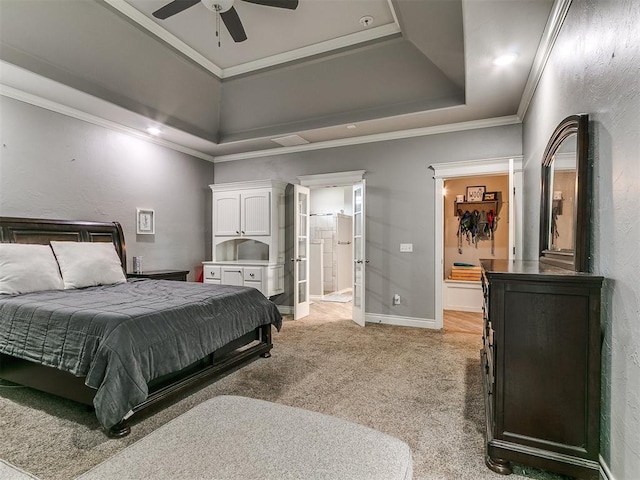 2395 County Road 1260, Blanchard, OK 73010 - bedroom featuring a tray ceiling, light carpet, ensuite bathroom, ornamental molding, and ceiling fan