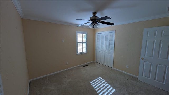 3957 N 58th Ter, Oklahoma City, OK 73112 - unfurnished bedroom featuring ornamental molding, a closet, carpet, and ceiling fan