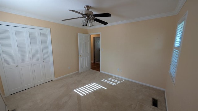 3957 N 58th Ter, Oklahoma City, OK 73112 - unfurnished bedroom with carpet floors, a closet, crown molding, and ceiling fan