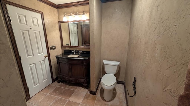 3957 N 58th Ter, Oklahoma City, OK 73112 - half bathroom featuring stone tile flooring, vanity, a textured wall, and crown molding
