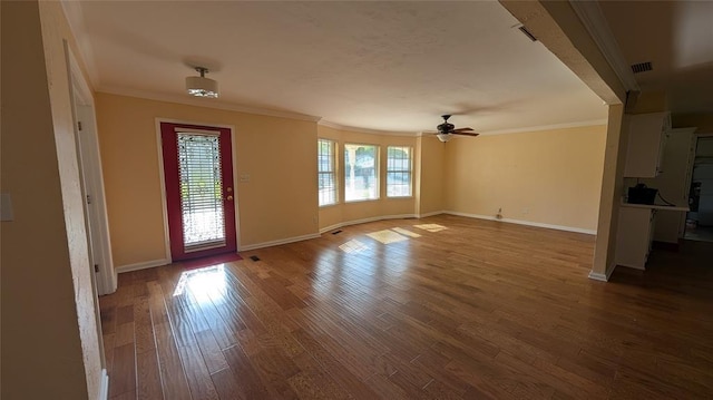 3957 N 58th Ter, Oklahoma City, OK 73112 - spare room with ornamental molding, ceiling fan, and wood finished floors