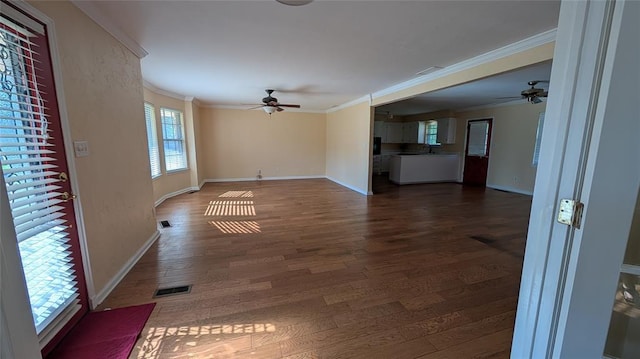 3957 N 58th Ter, Oklahoma City, OK 73112 - unfurnished living room with ceiling fan, crown molding, and dark wood finished floors