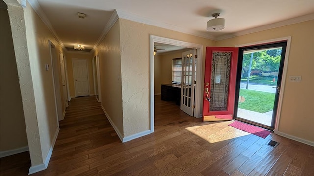 3957 N 58th Ter, Oklahoma City, OK 73112 - entrance foyer featuring ornamental molding, wood finished floors, and a textured wall