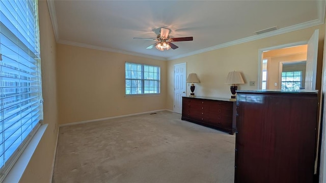 3957 N 58th Ter, Oklahoma City, OK 73112 - bedroom featuring multiple windows, crown molding, light carpet, and a ceiling fan
