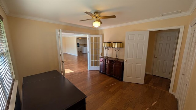 3957 N 58th Ter, Oklahoma City, OK 73112 - bedroom featuring french doors, dark wood finished floors, crown molding, and ceiling fan