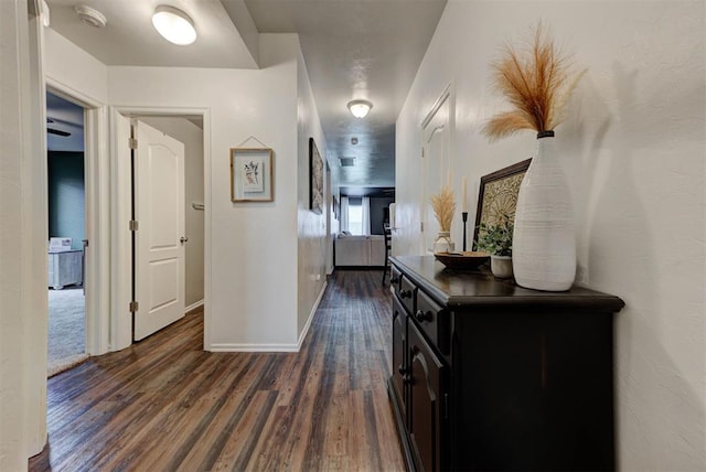 11704 NW 135th Ter, Piedmont, OK 73078 - hallway featuring dark wood finished floors and baseboards