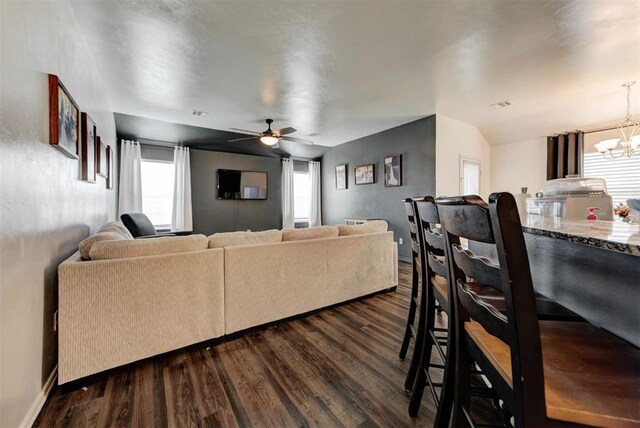 11704 NW 135th Ter, Piedmont, OK 73078 - living area featuring a chandelier, dark wood-type flooring, and a ceiling fan