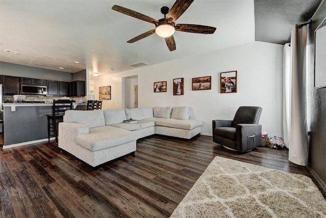 11704 NW 135th Ter, Piedmont, OK 73078 - living area with ceiling fan and dark wood-style flooring
