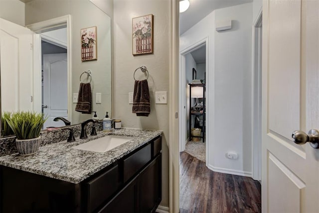 11704 NW 135th Ter, Piedmont, OK 73078 - bathroom with wood finished floors and vanity