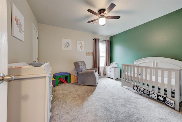 11704 NW 135th Ter, Piedmont, OK 73078 - bedroom featuring carpet, a crib, and a ceiling fan