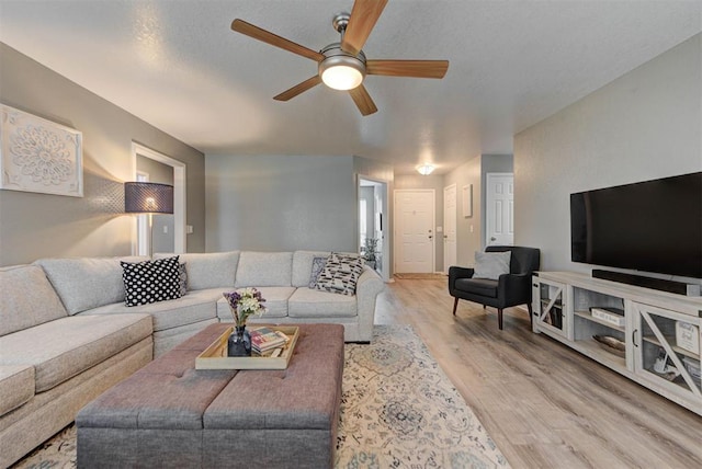 8517 SW 36th Ter, Oklahoma City, OK 73179 - living area with a ceiling fan and wood finished floors