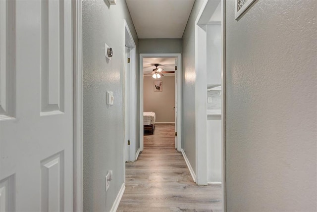 8517 SW 36th Ter, Oklahoma City, OK 73179 - corridor with light wood-style floors and a textured wall